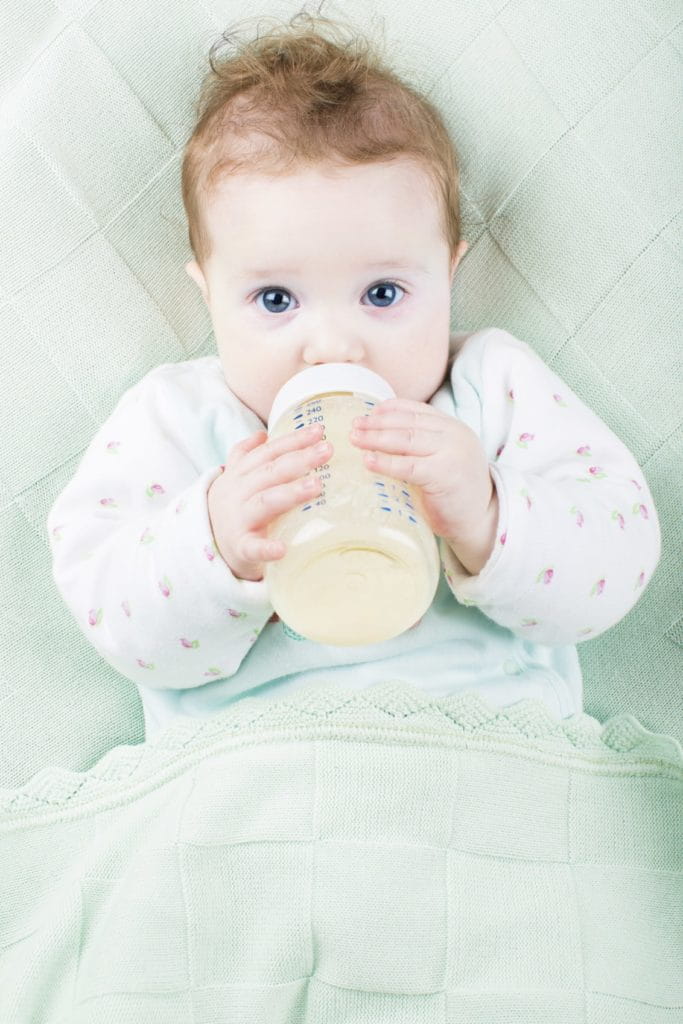 baby drinking from bottle